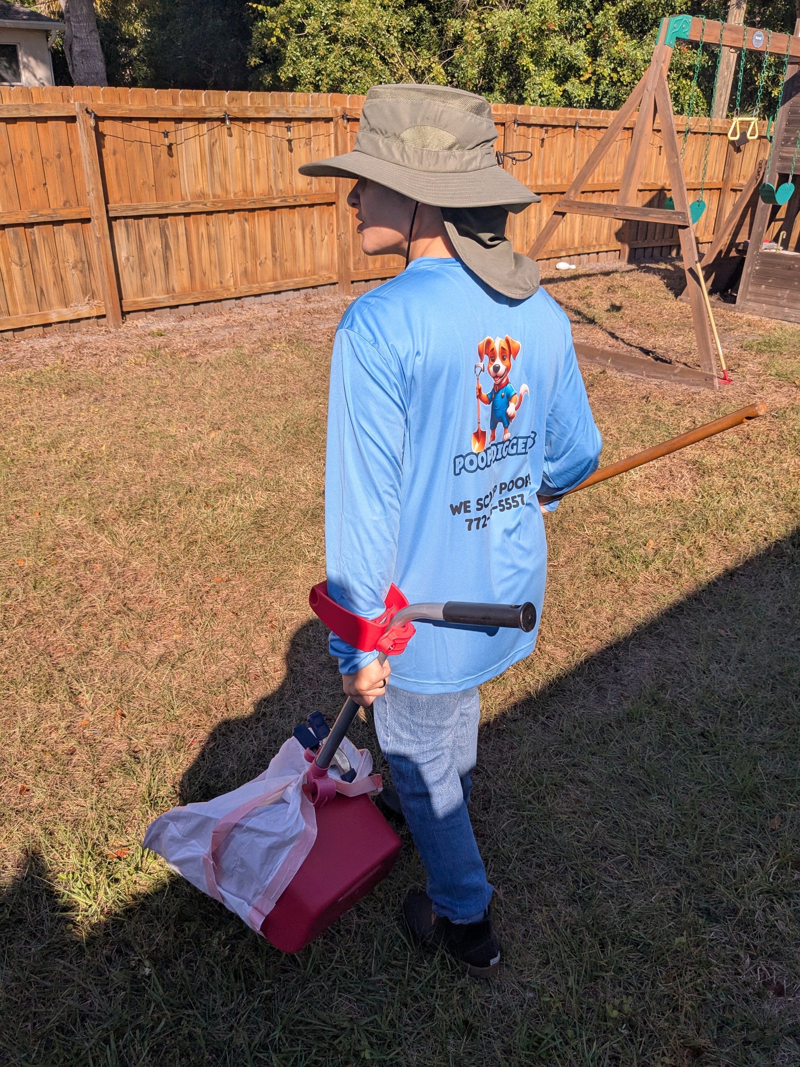 Poop Diggers technician at work in a backyard